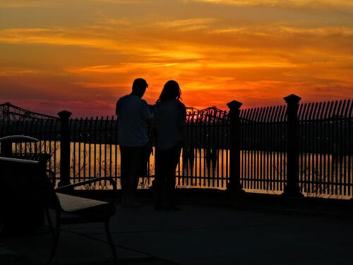 Couple-Enjoying-Sunset-by-Joan-Heard