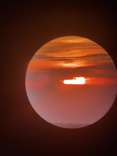 Sunset-through-a-telescope-by-Jef-Spiessens