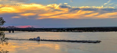 Towboat-at-Sunset-by-Lawrence-Davis